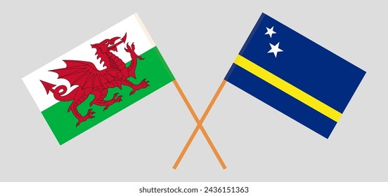 Crossed flags of Wales and Country of Curacao. Official colors. Correct proportion. Vector illustration
