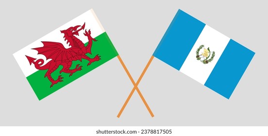 Crossed flags of Wales and Guatemala. Official colors. Correct proportion. Vector illustration
