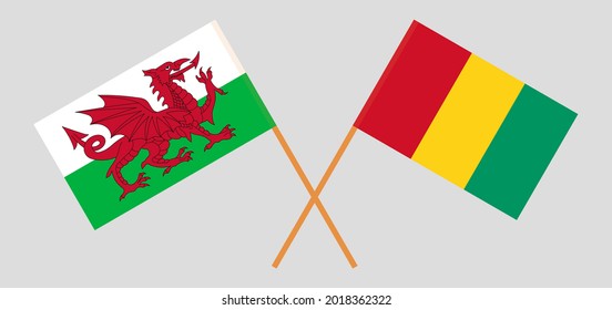 Crossed flags of Wales and Guinea. Official colors. Correct proportion