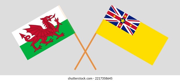 Crossed flags of Wales and Niue. Official colors. Correct proportion. Vector illustration
