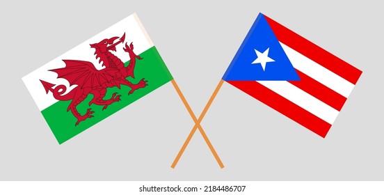Crossed flags of Wales and Puerto Rico. Official colors. Correct proportion. Vector illustration
