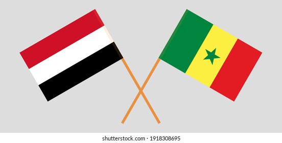Crossed flags of Yemen and Senegal