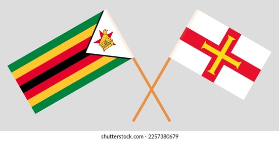 Crossed flags of Zimbabwe and Bailiwick of Guernsey. Official colors. Correct proportion. Vector illustration
