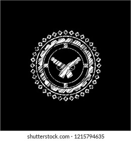 crossed pistols icon drawn on a blackboard