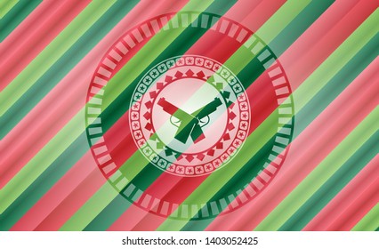 crossed pistols icon inside christmas style badge..