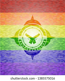 crossed pistols icon inside emblem on mosaic background with the colors of the LGBT flag