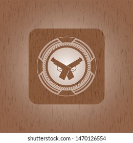 crossed pistols icon inside retro wooden emblem