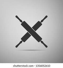Crossed rolling pins icon isolated on grey background. Kitchen utensils and equipment. Flat design. Vector Illustration