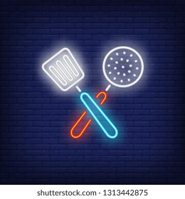 Crossed slotted spoon and turner neon sign. Cooking and kitchen utensils design. Night bright neon sign, colorful billboard, light banner. Vector illustration in neon style.