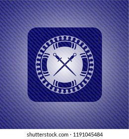 crossed swords icon inside badge with denim background