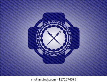crossed swords icon inside emblem with jean background