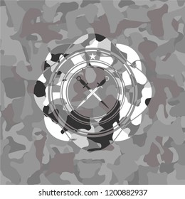 crossed swords icon inside grey camouflage texture