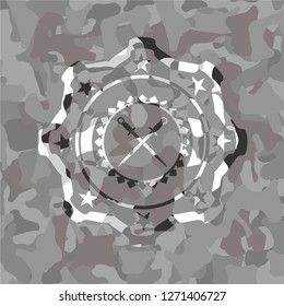 crossed swords icon inside grey camo texture