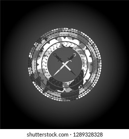crossed swords icon inside grey camouflaged emblem