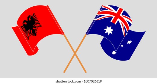 Crossed and waving flags of Albania and Australia