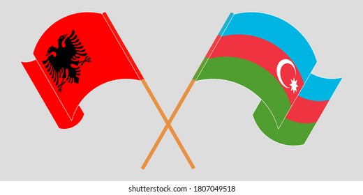 Crossed and waving flags of Albania and Azerbaijan