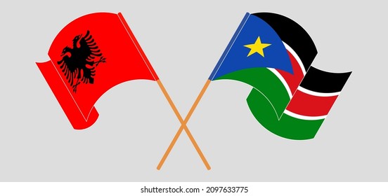 Crossed and waving flags of Albania and South Sudan. Vector illustration

