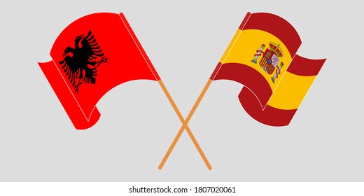 Crossed and waving flags of Albania and Spain