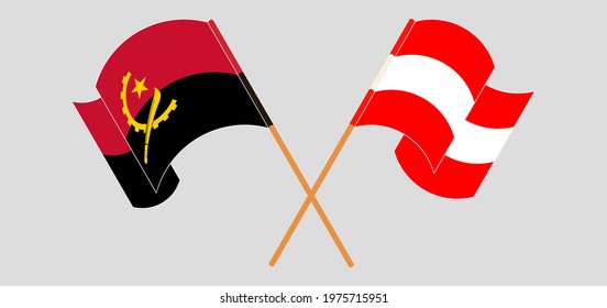 Crossed and waving flags of Angola and Austria