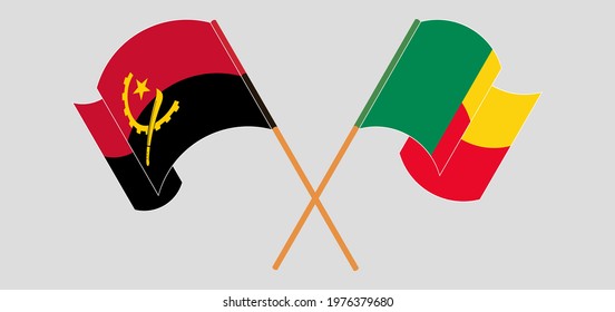 Crossed and waving flags of Angola and Benin