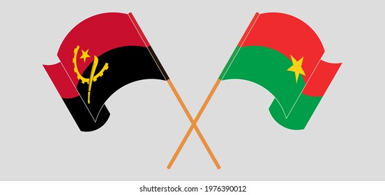 Crossed and waving flags of Angola and Burkina Faso