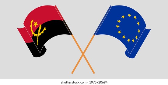 Crossed and waving flags of Angola and the European Union