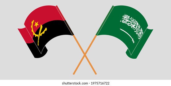 Crossed and waving flags of Angola and the Kingdom of Saudi Arabia