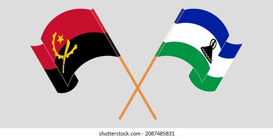 Crossed and waving flags of Angola and Kingdom of Lesotho. Vector illustration
