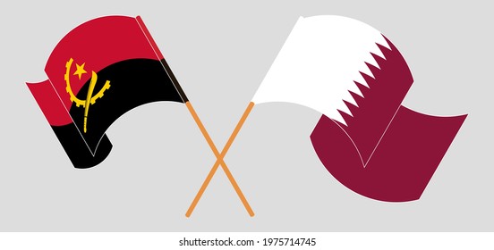 Crossed and waving flags of Angola and Qatar