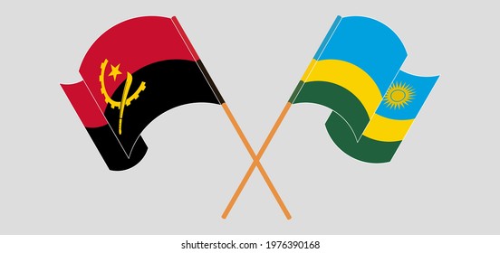 Crossed and waving flags of Angola and Rwanda