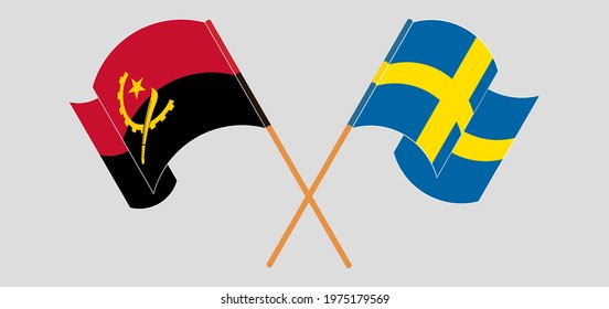 Crossed and waving flags of Angola and Sweden
