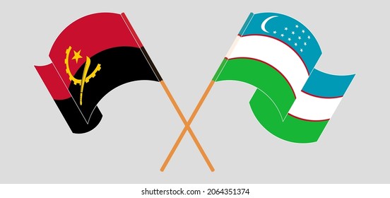 Crossed and waving flags of Angola and Uzbekistan