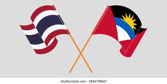 Gekreuzte und wehende Flaggen von Antigua und Barbuda und Thailand