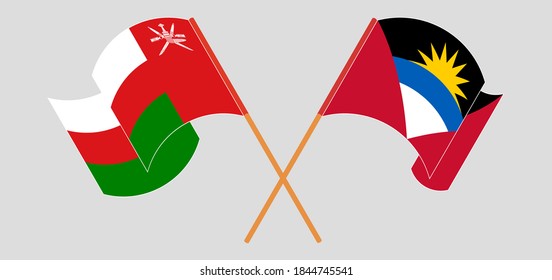 Crossed and waving flags of Antigua and Barbuda and Oman