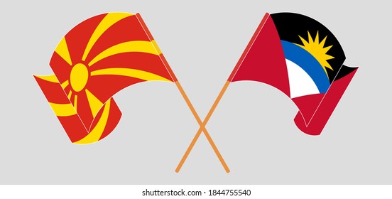 Crossed and waving flags of Antigua and Barbuda and North Macedonia