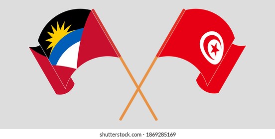 Crossed and waving flags of Antigua and Barbuda and Tunisia