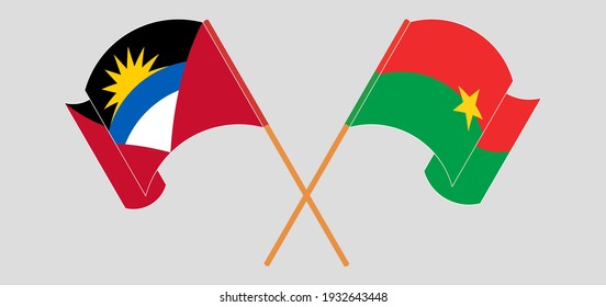 Crossed and waving flags of Antigua and Barbuda and Burkina Faso