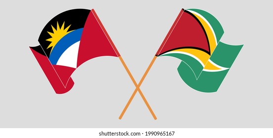 Banderas cruzadas y ondeando banderas de Antigua y Barbuda y Guyana