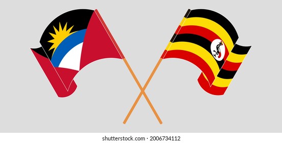 Crossed and waving flags of Antigua and Barbuda and Uganda