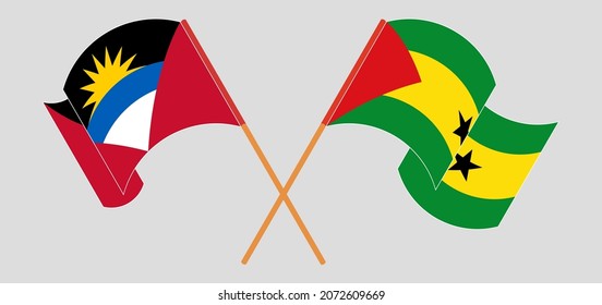 Crossed and waving flags of Antigua and Barbuda and Sao Tome and Principe