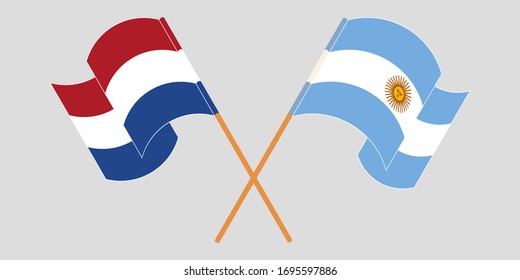 Crossed and waving flags of Argentina and the Netherlands