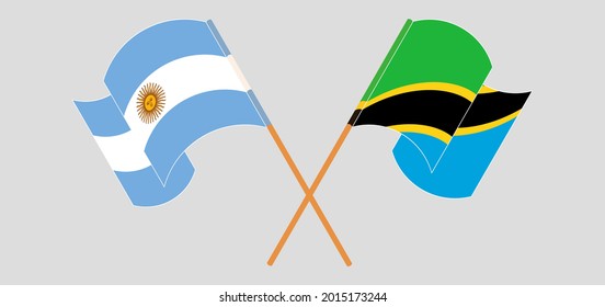 Crossed and waving flags of Argentina and Tanzania