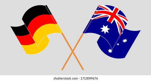 Banderas cruzadas y ondeando banderas de Australia y Alemania