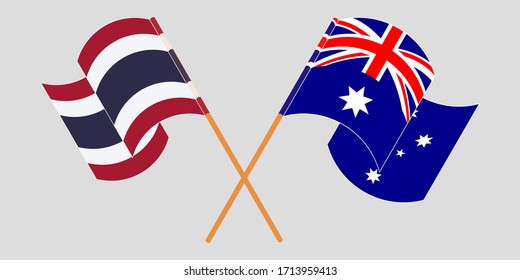 Crossed and waving flags of Australia and Thailand