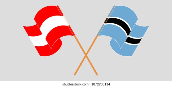 Crossed and waving flags of Austria and Botswana