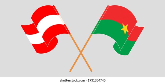Crossed and waving flags of Austria and Burkina Faso