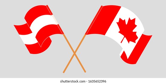 Crossed and waving flags of Austria and Canada
