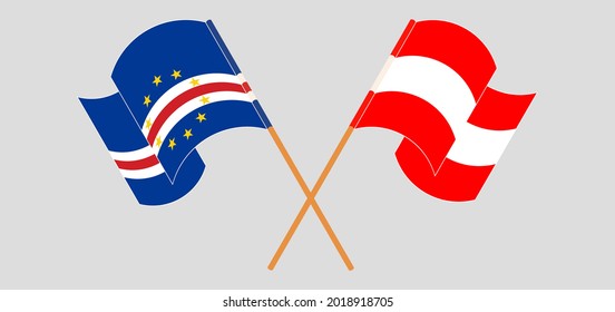 Crossed and waving flags of Austria and Cape Verde