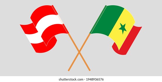 Crossed and waving flags of Austria and Senegal