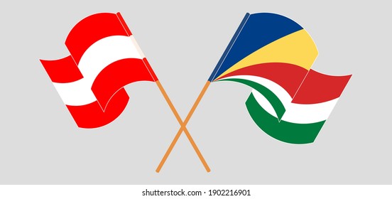 Überquerte und wehende Flaggen Österreichs und der Seychellen